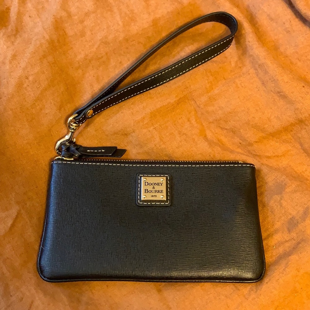 Dooney & Bourke black & gold wallet/clutch. Brand new without tags. Never used.